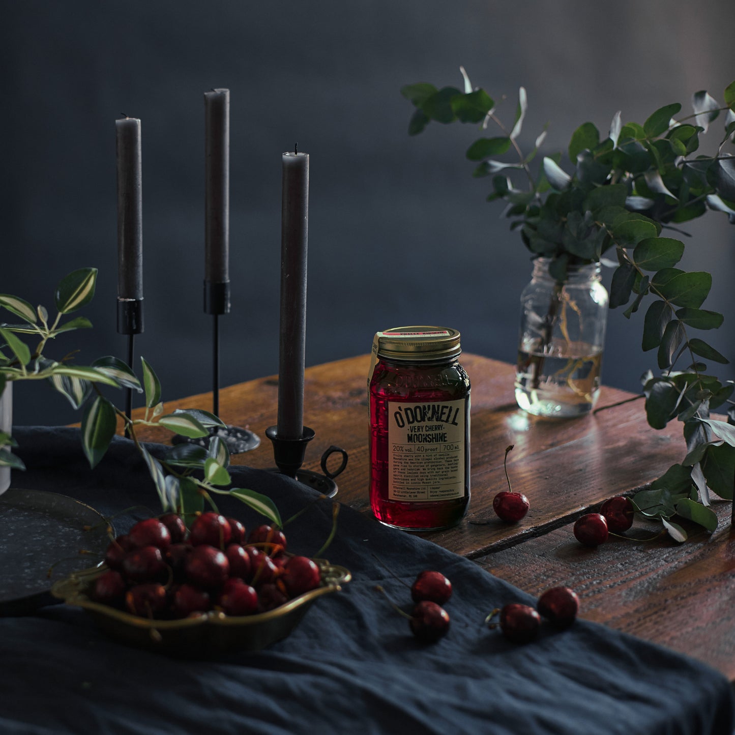 Very Cherry Moonshine with cherries and plants